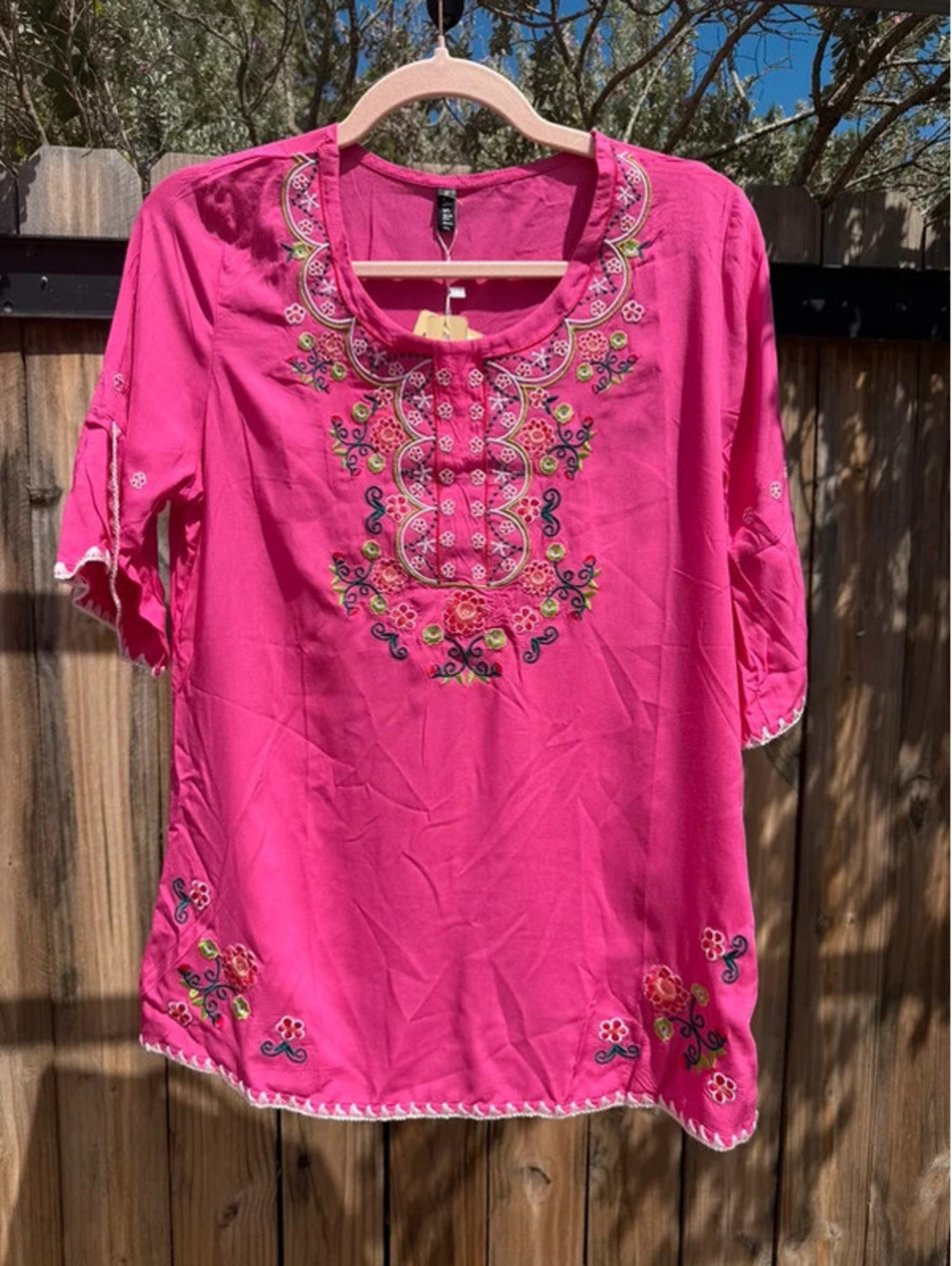 NWT- vibrant pink Embroidered Peasant Top with colorful floral embroidery